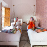 twin beds in orange blossom room tea